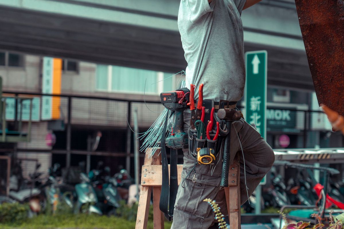 Tool belt and ladder ready for a range of odd jobs