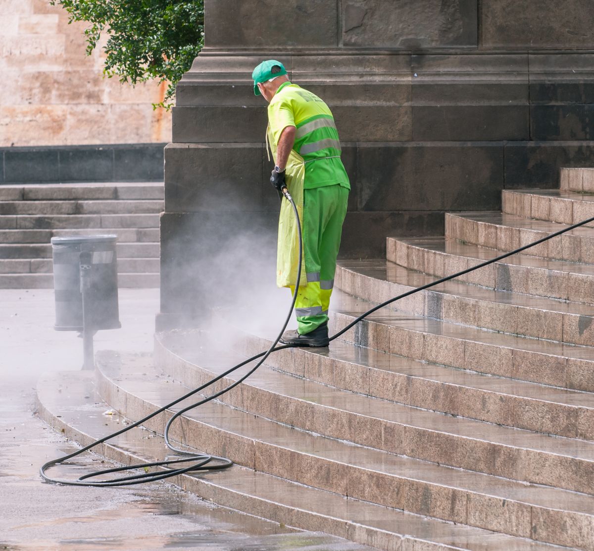 Exterior surfaces being maintained with a pressure washer