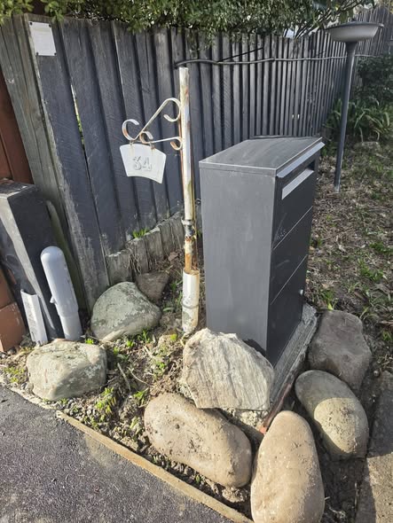 Fence and utility box area repaired and tidied after the job